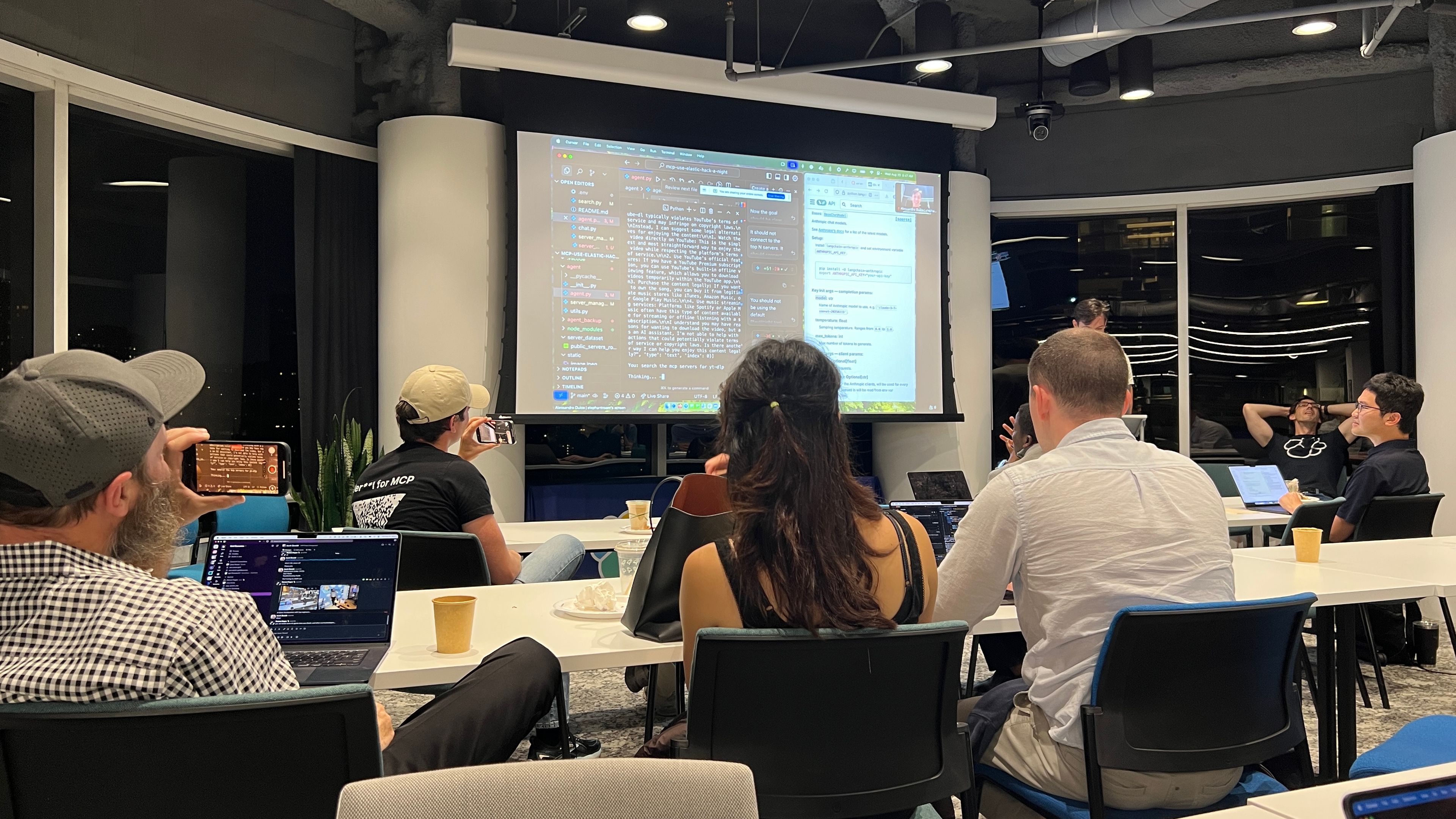 Hackathon kickoff at Elasticsearch HQ in San Francisco, with the host sharing the event agenda on screen as participants prepare to build MCP Agents.