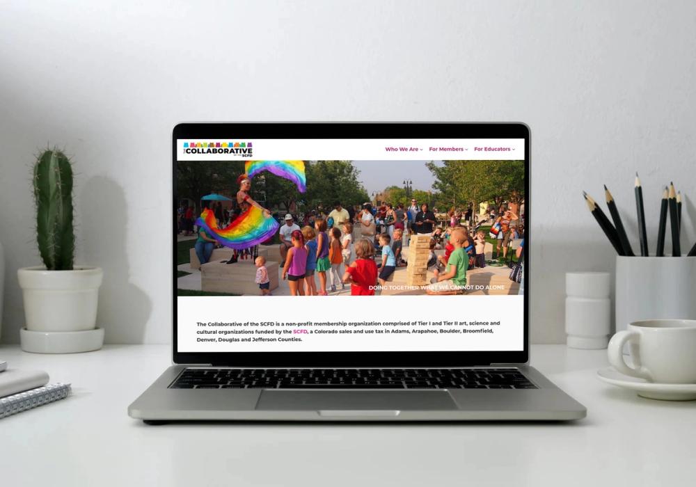 The Collaborative of the SCFD homepage on a laptop, with intro copy about the organization