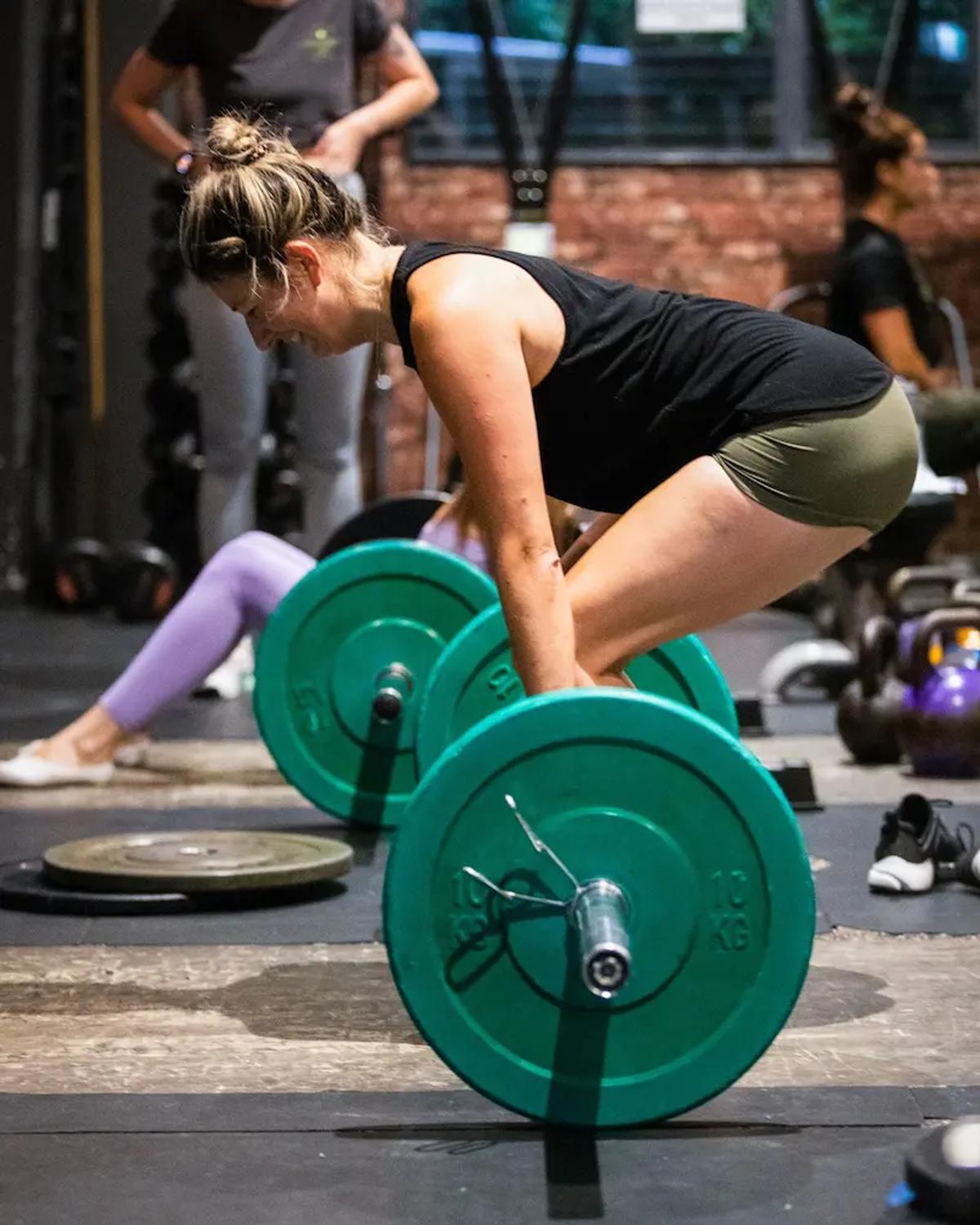 Member setting up for a barbell deadlift