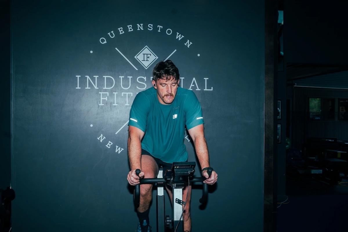 Member training on the assault bike at Industrial Fitness.