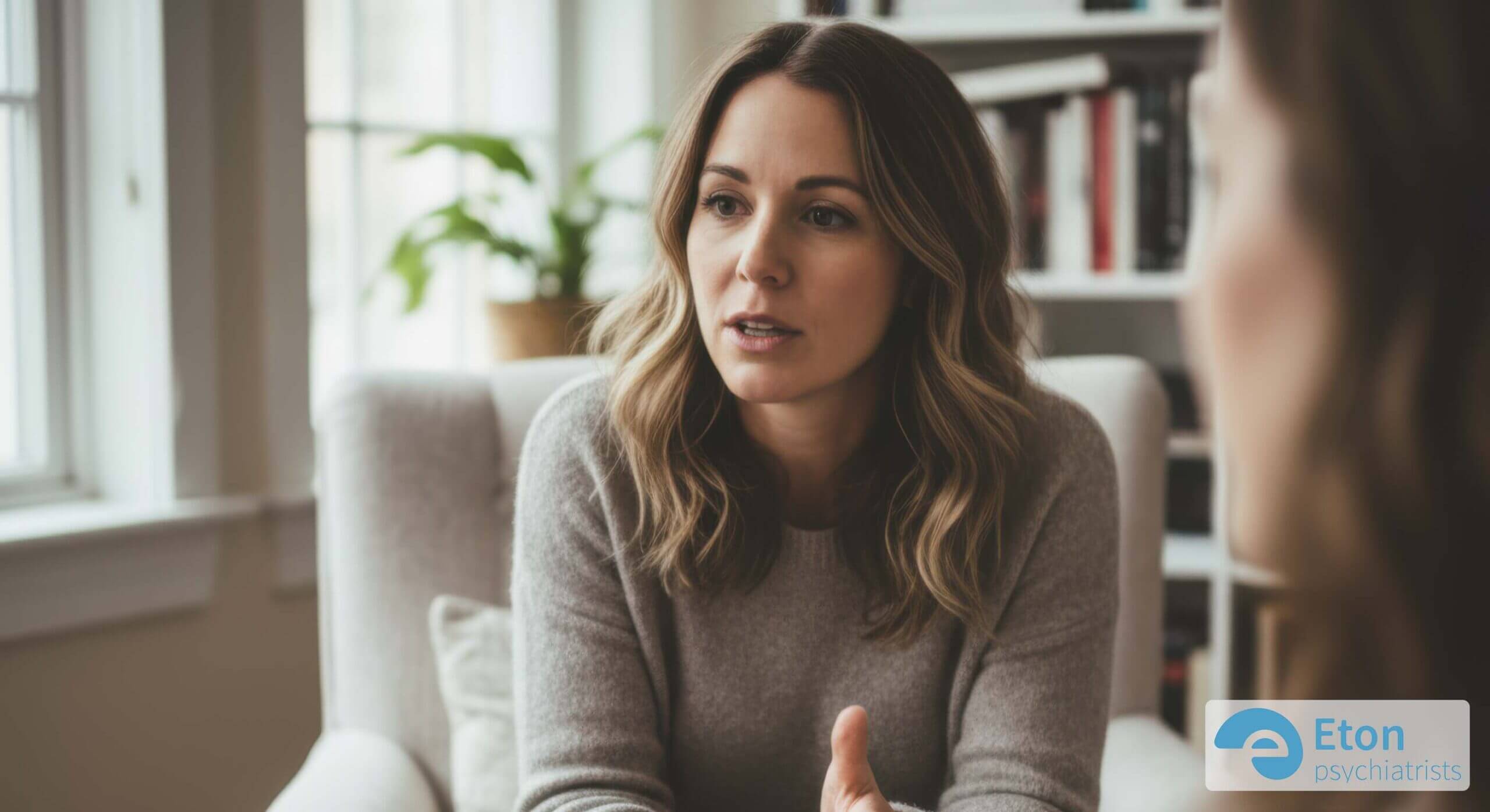 A clinician listening attentively as a patient shares their experiences during a comprehensive ADHD assessment interview.