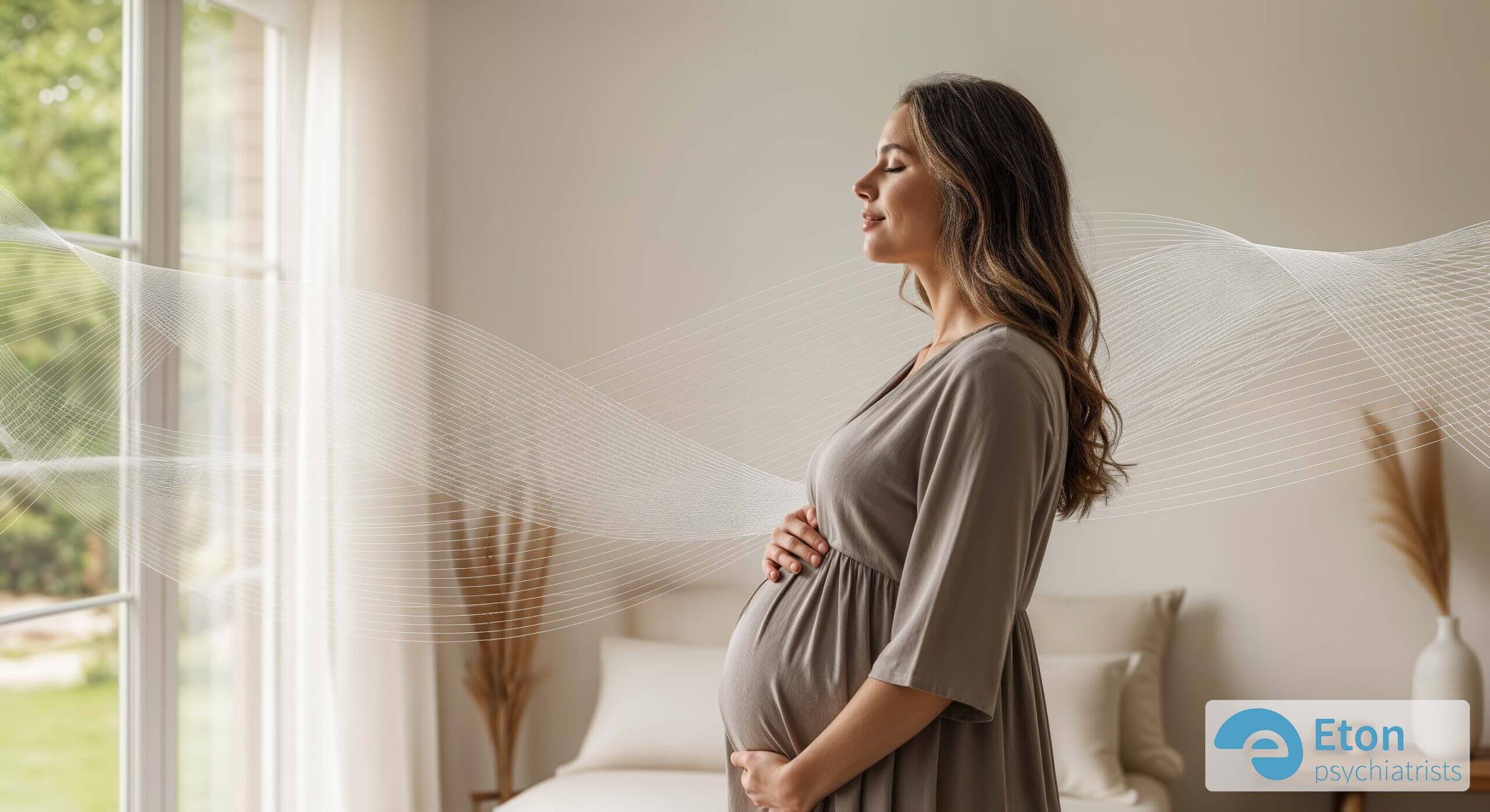 A serene pregnant woman standing by a window with her eyes closed, looking calm and content.