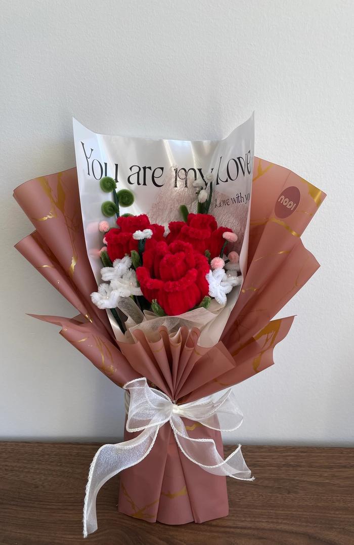 Deep red pipecleaner rose arrangement with baby's breath