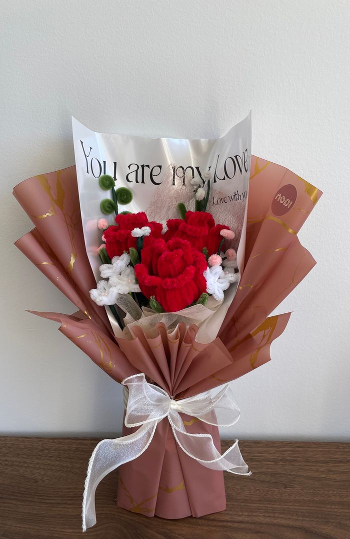Deep red pipecleaner rose arrangement with baby's breath