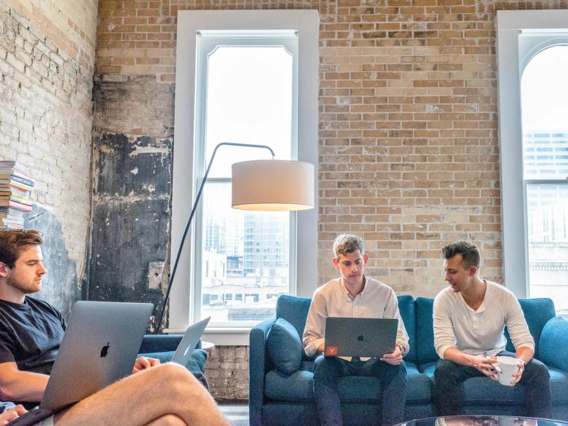 team working in a startup on sofas