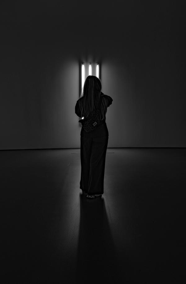 Woman in front of light
