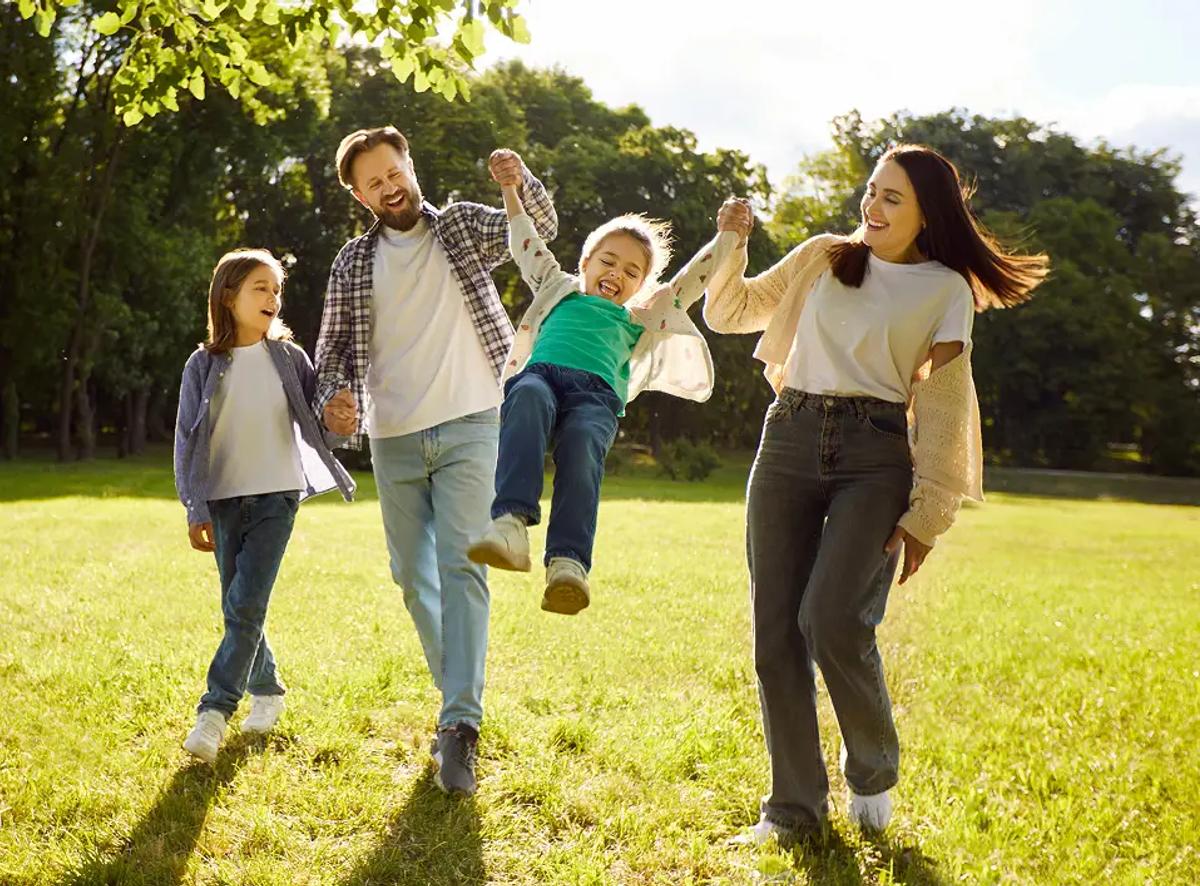 Happy family walking on a sunny day