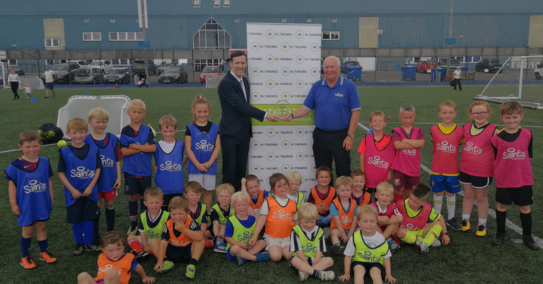 Mark Riddell receives m3s Saints in the Community award.
