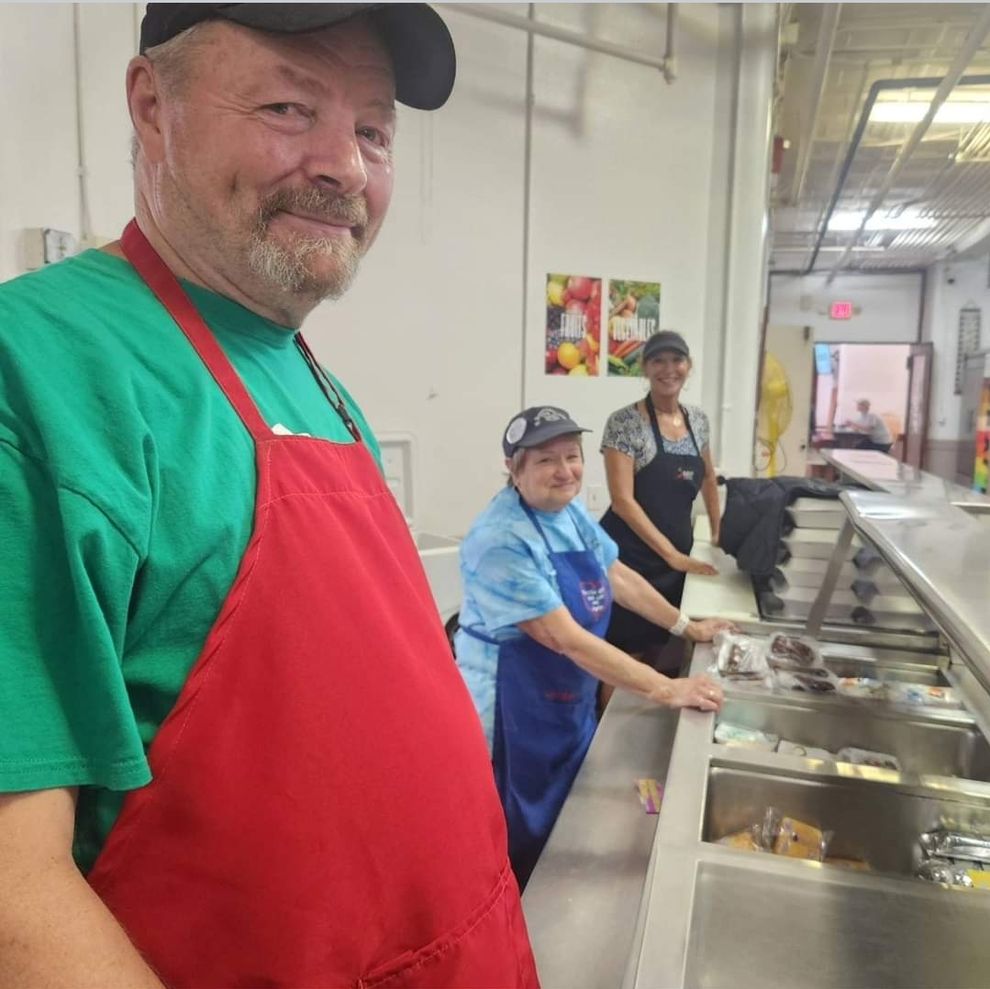 Volunteers ready to serve lunch to the community