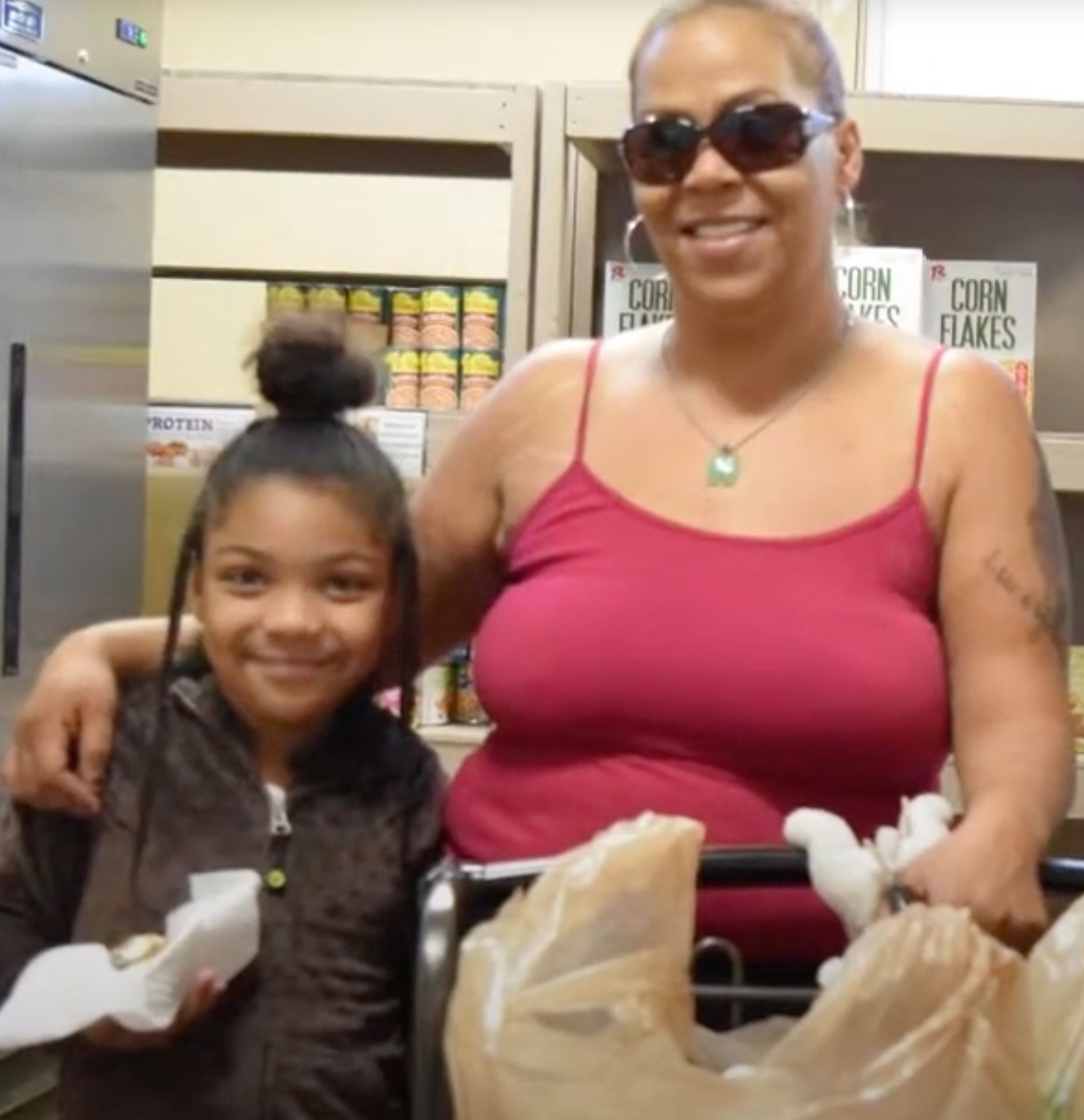 Mother and daughter at the food pantry