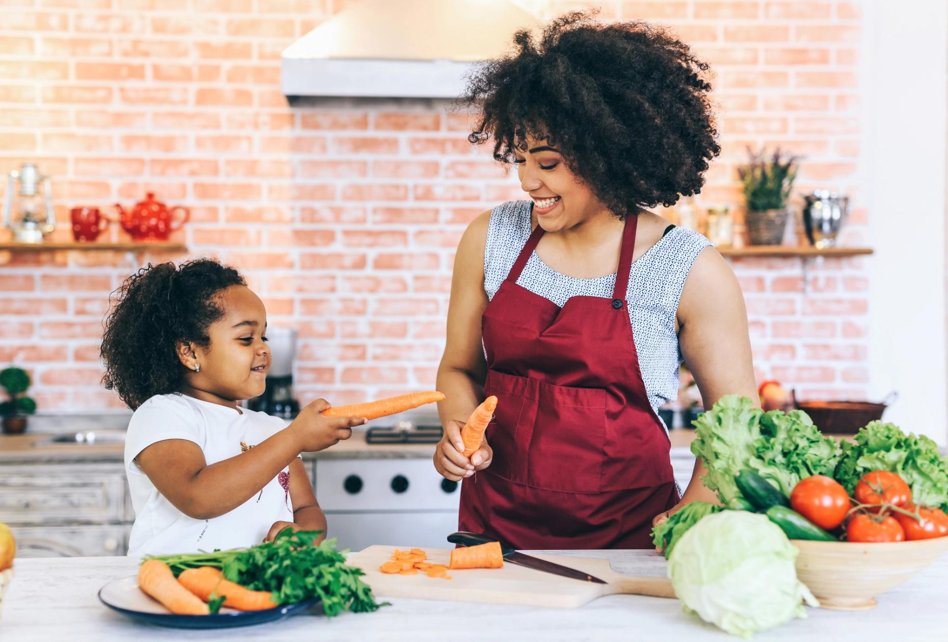 Mother and daughter making nutritious meal