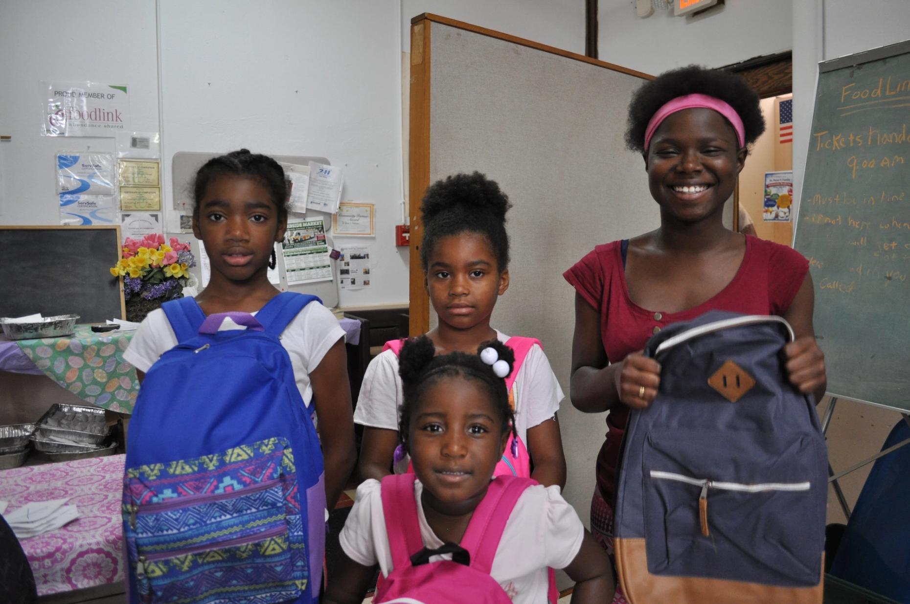 Four girls with their new backpacks