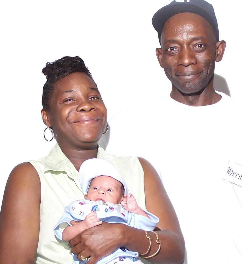Mother, father and a baby.