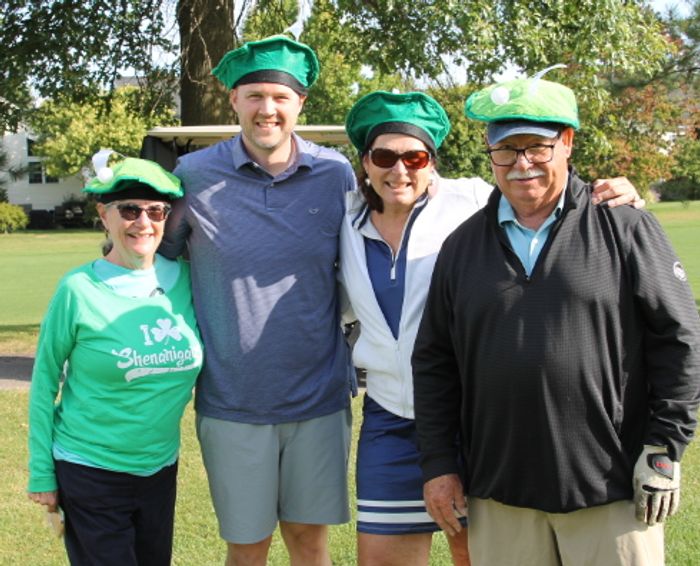 Foursome at the golf tournament