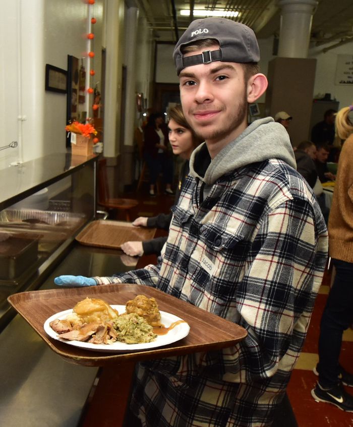 Man eating a Thanksgiving diner