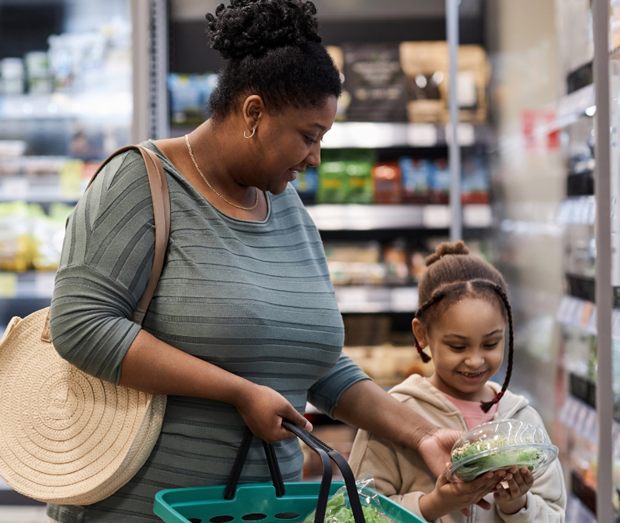 Woman with child looking at groceries