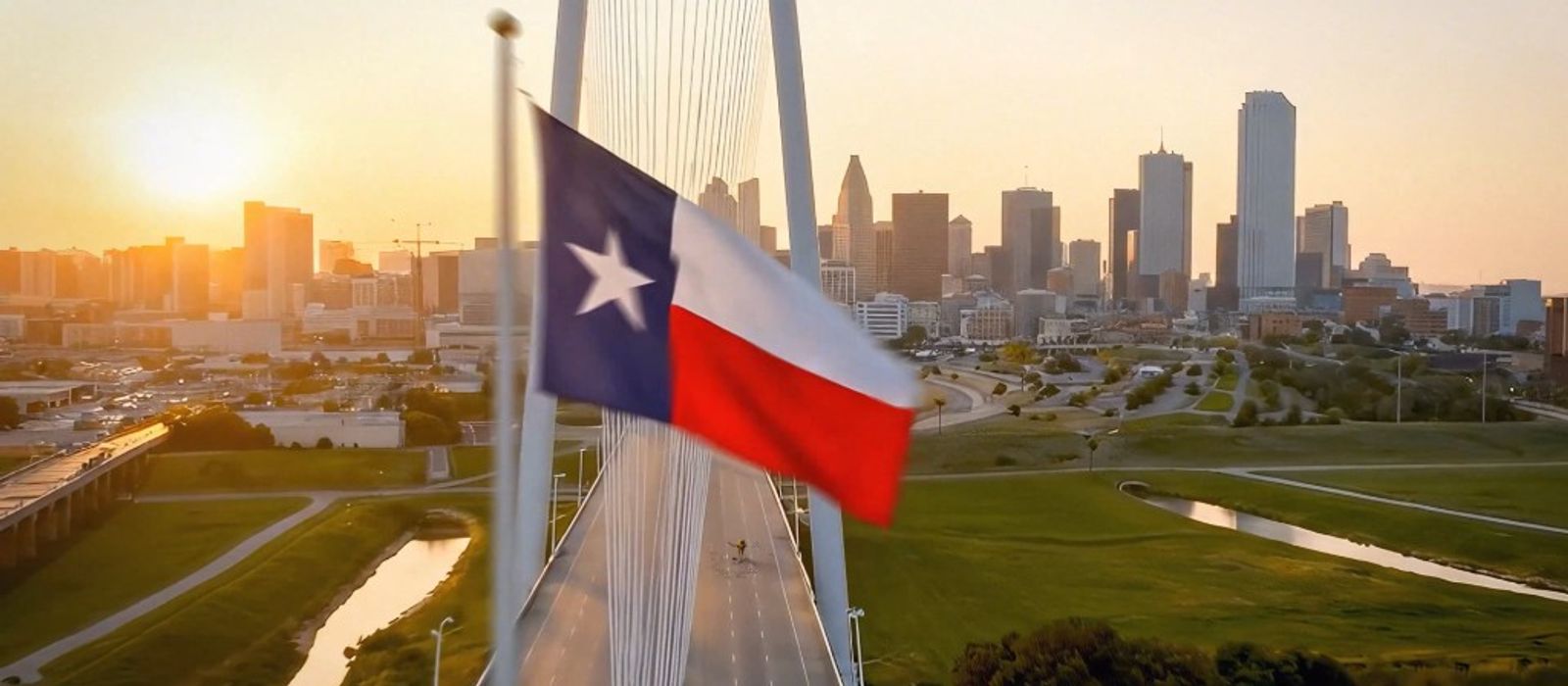 Texas flag and Dallas skyline at sunset with cable-stayed bridge
