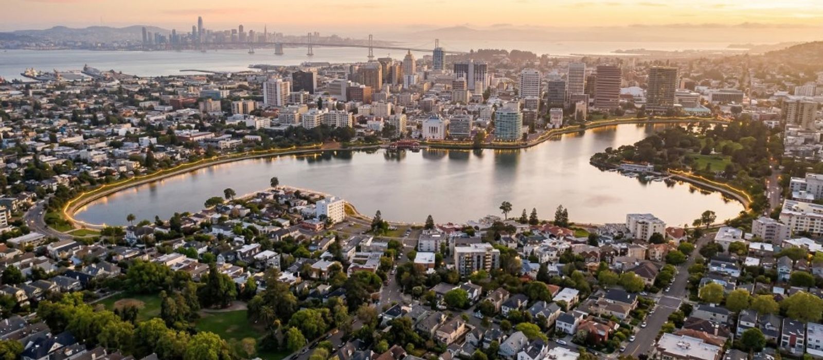 Aerial view of Oakland and Lake Merritt with Bay Bridge and San Francisco in the distance