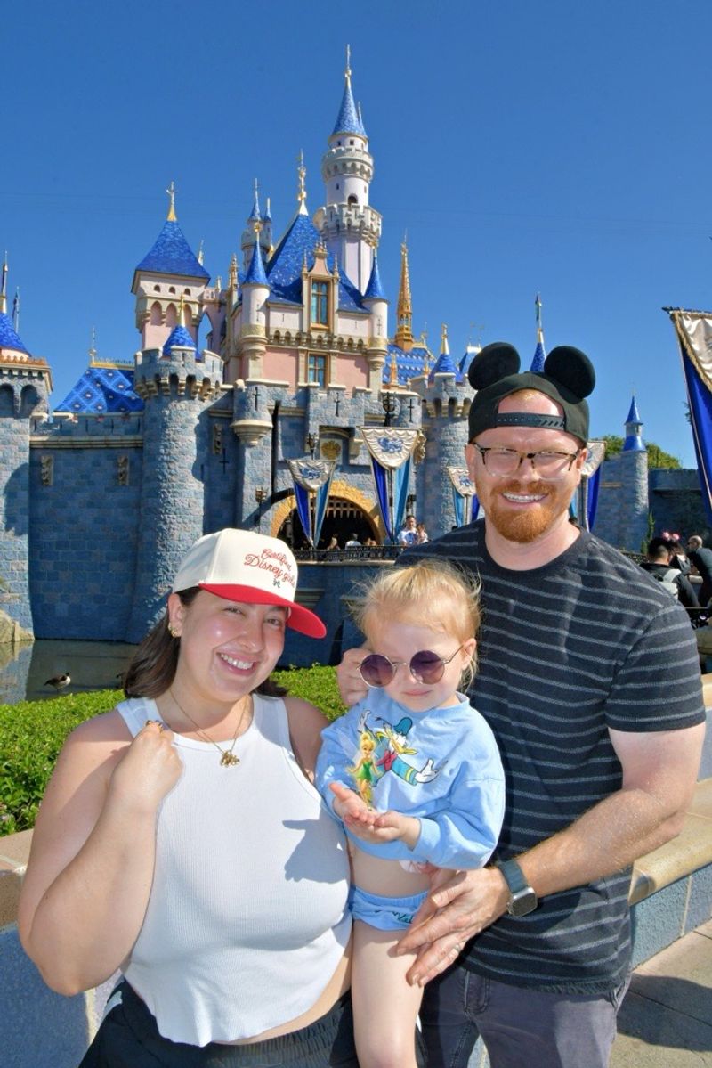 Matt Mayo and family at Disneyland in front of Sleeping Beauty Castle
