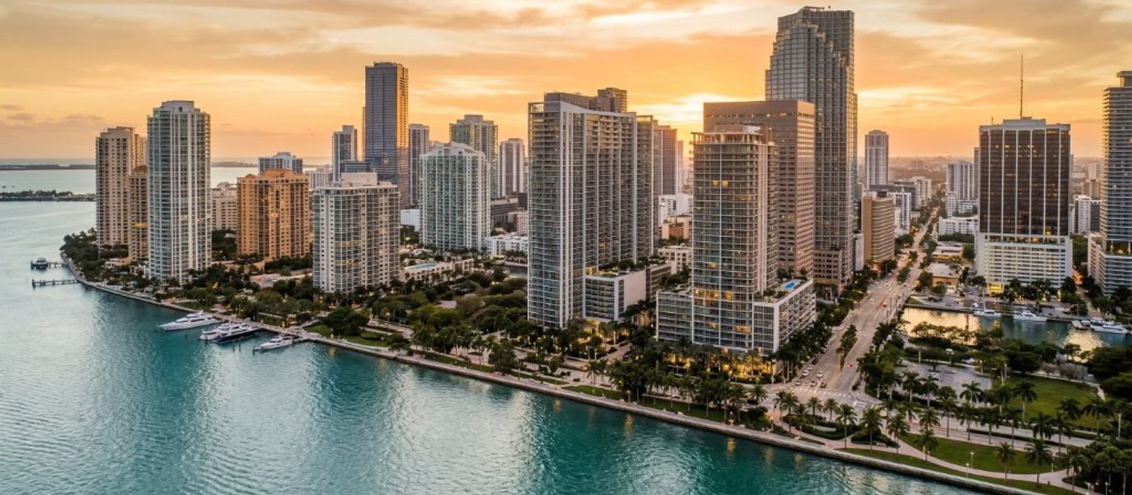 Aerial view of Miami Brickell skyline along Biscayne Bay at golden hour