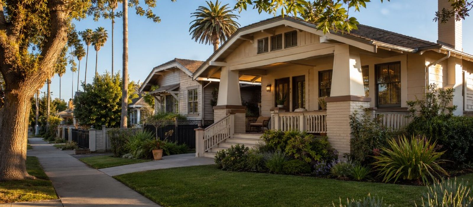 A 1920s California bungalow on a palm-lined residential street in Long Beach