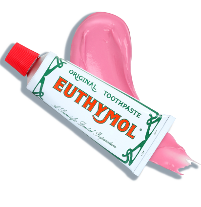 An image of Euthymol Original Toothpaste tube over a swatch of pink toothpaste texture.