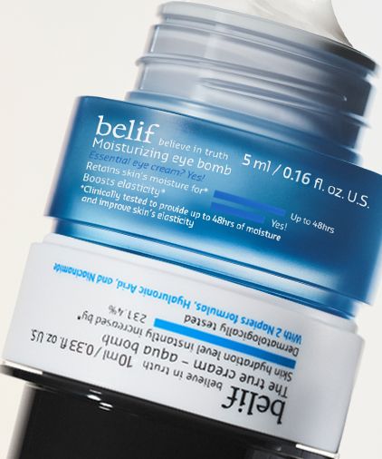 A close-up photo of belif Aqua Bomb True Cream and Moisturizing Eye Bomb product jars with its lid partially open, highlighting the product name and its claim of up to 48 hours of hydration.