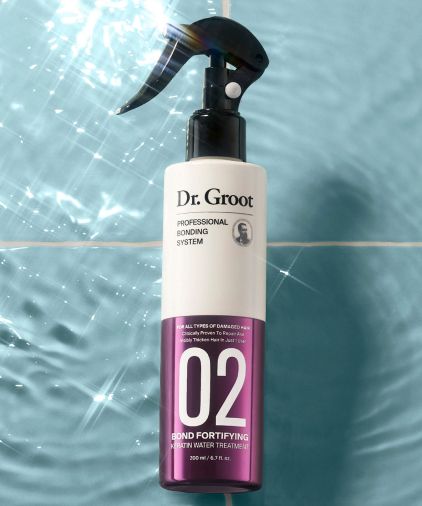 Dr. Groot Professional Bonding System #2 Keratin Water on a blue titled surface and background.