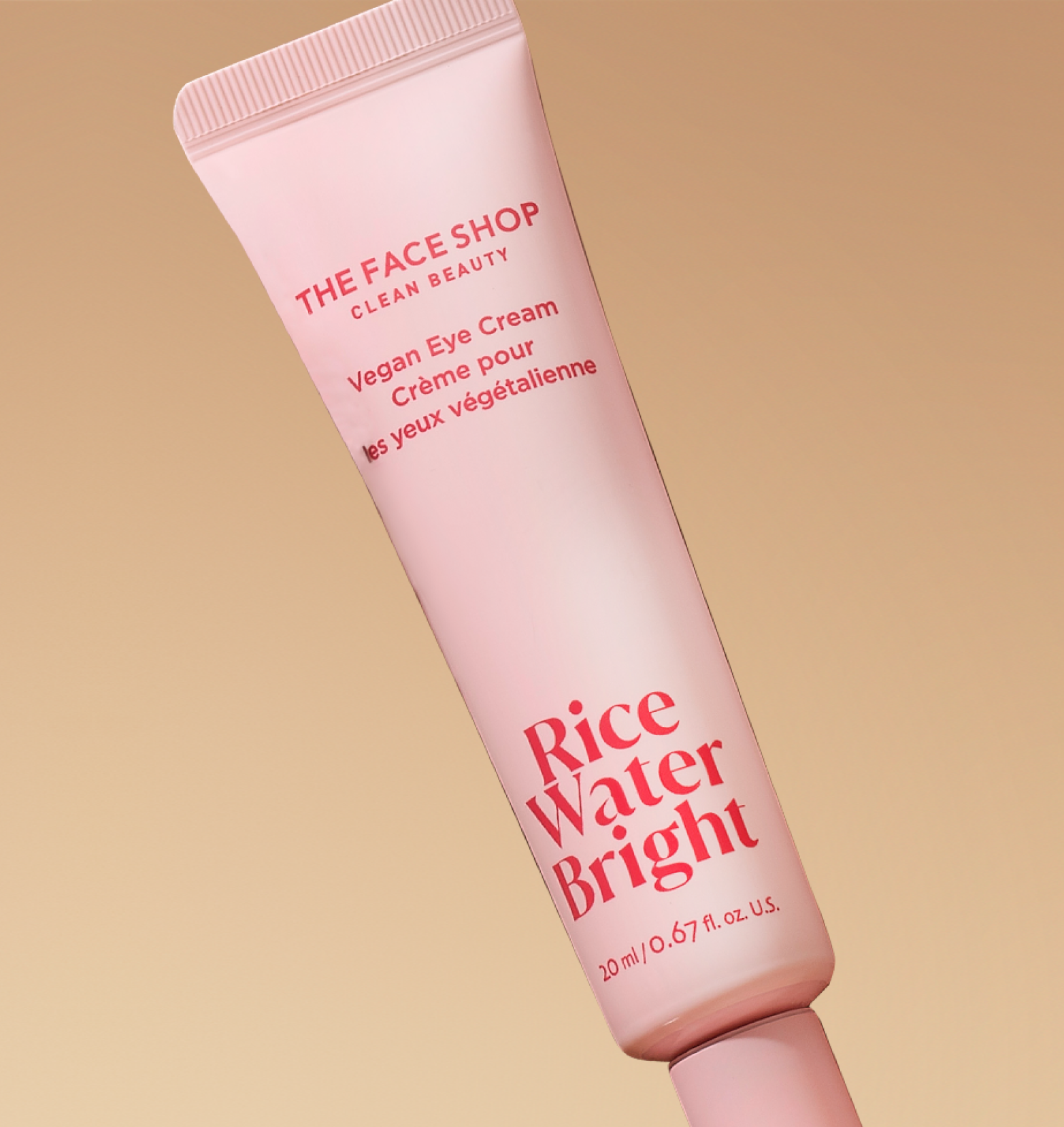 The Face Shop Rice Water Bright Vegan Eye Cream on a warm beige background