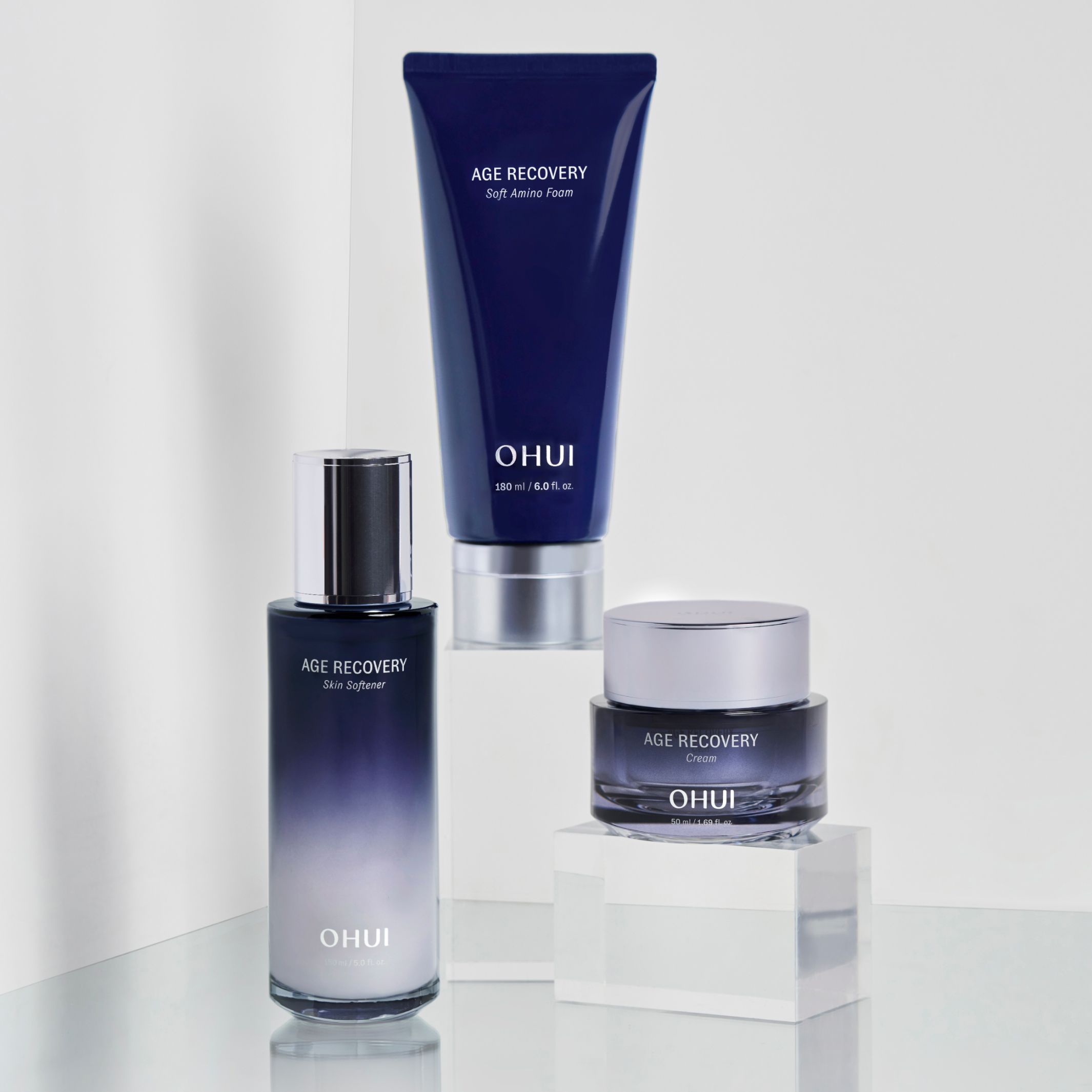Three products from the OHUI Age Recovery collection showcased against a white backdrop.