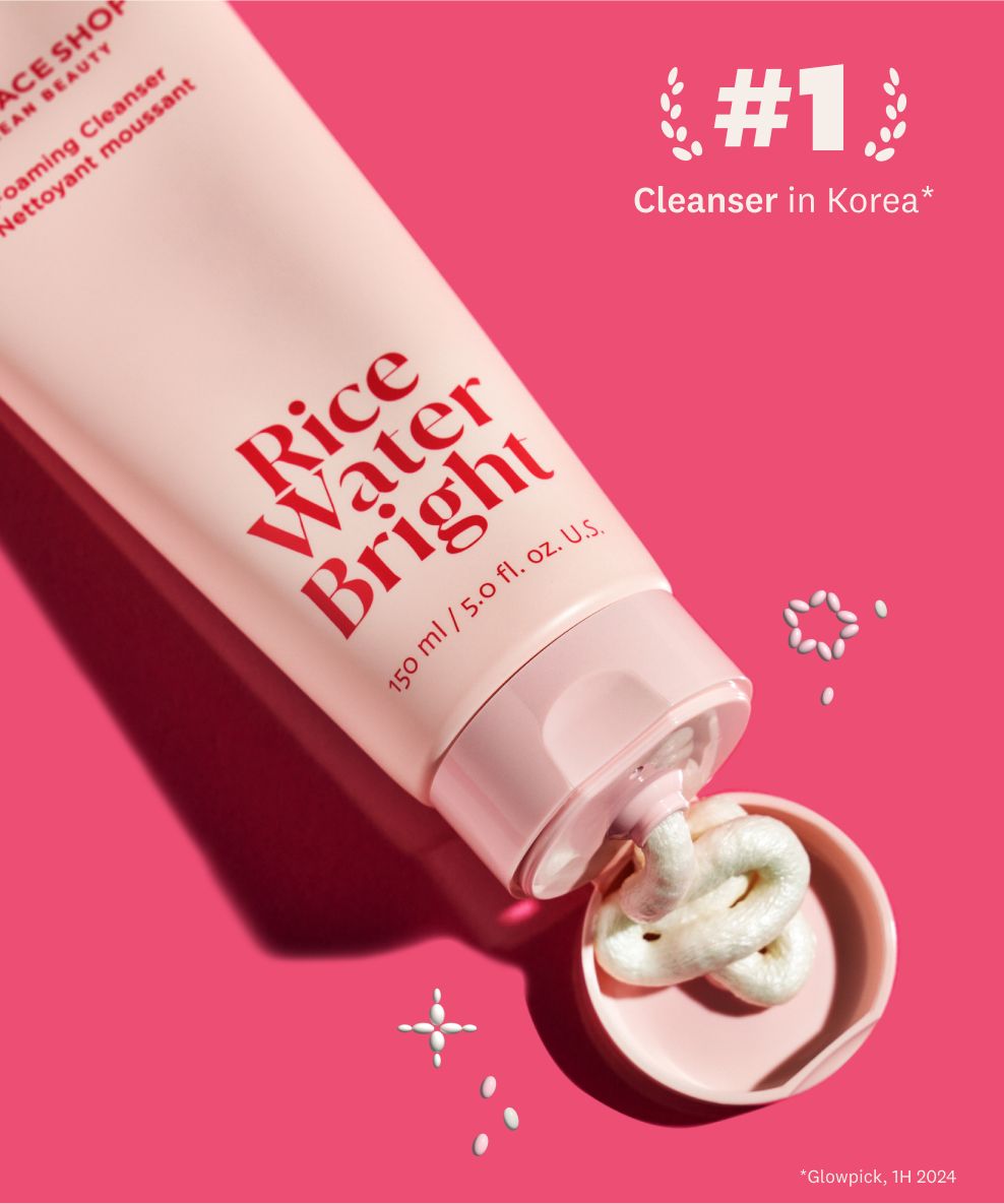 A light pink tube of The Face Shop Rice Water Bright Foaming Cleanser dispenses white cream into its cap on a hot pink background, with text '#1 Cleanser in Korea'.