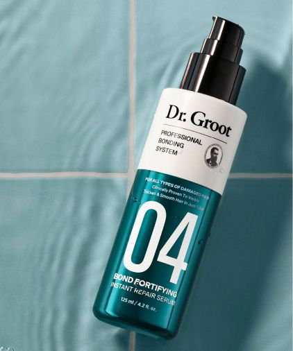 Dr. Groot Professional Bonding System #4 Repair Serum on a blue titled surface and background.