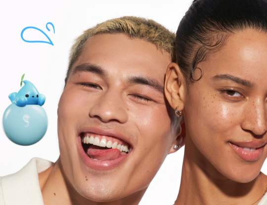 A joyful man winking and laughing, a woman next to him, and a blue water droplet mascot.