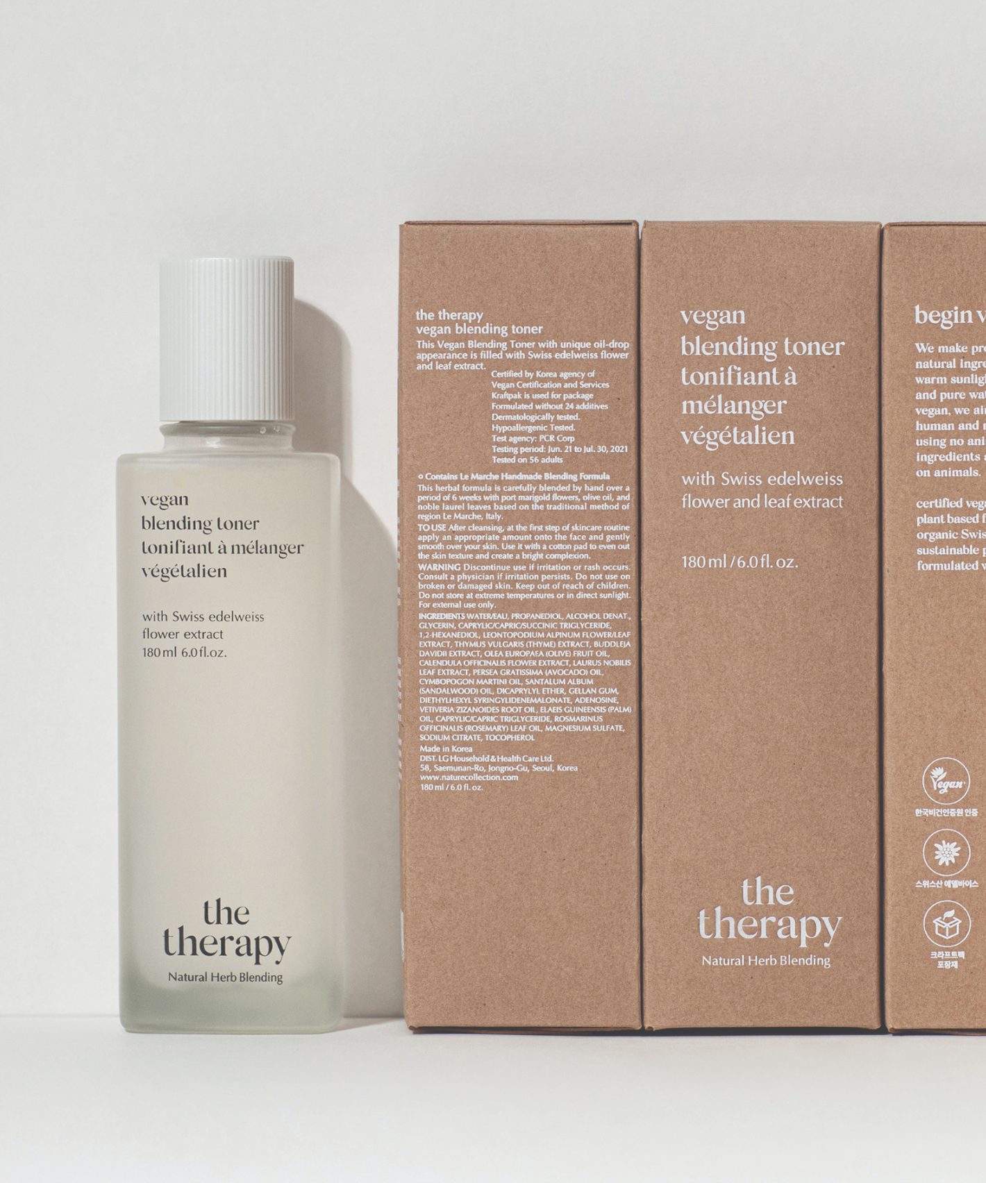 A bottle of The Face Shop Vegan Blending Toner standing along with the three boxes of the toner.