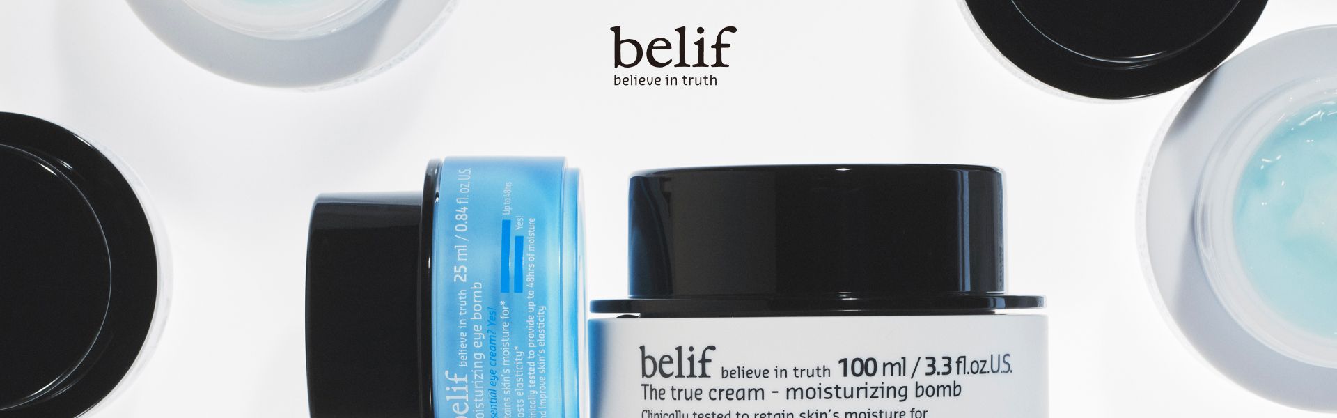 A closeup of belif Aqua Bomb and Moisturizing Bomb products on a white background with the belif logo and tagline.