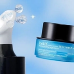 A Belif Moisturizing Eye Bomb jar next to a Belif Aqua Bomb Eye Gel with three clear spheres.