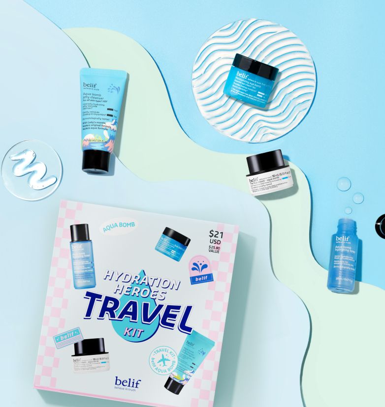 A box of belif Hydration Heroes with mini versions of Aqua Bomb Jelly Cleanser, Moisturizer, Toner, and Eye Bomb spread out underneath blue whimsical decorations.