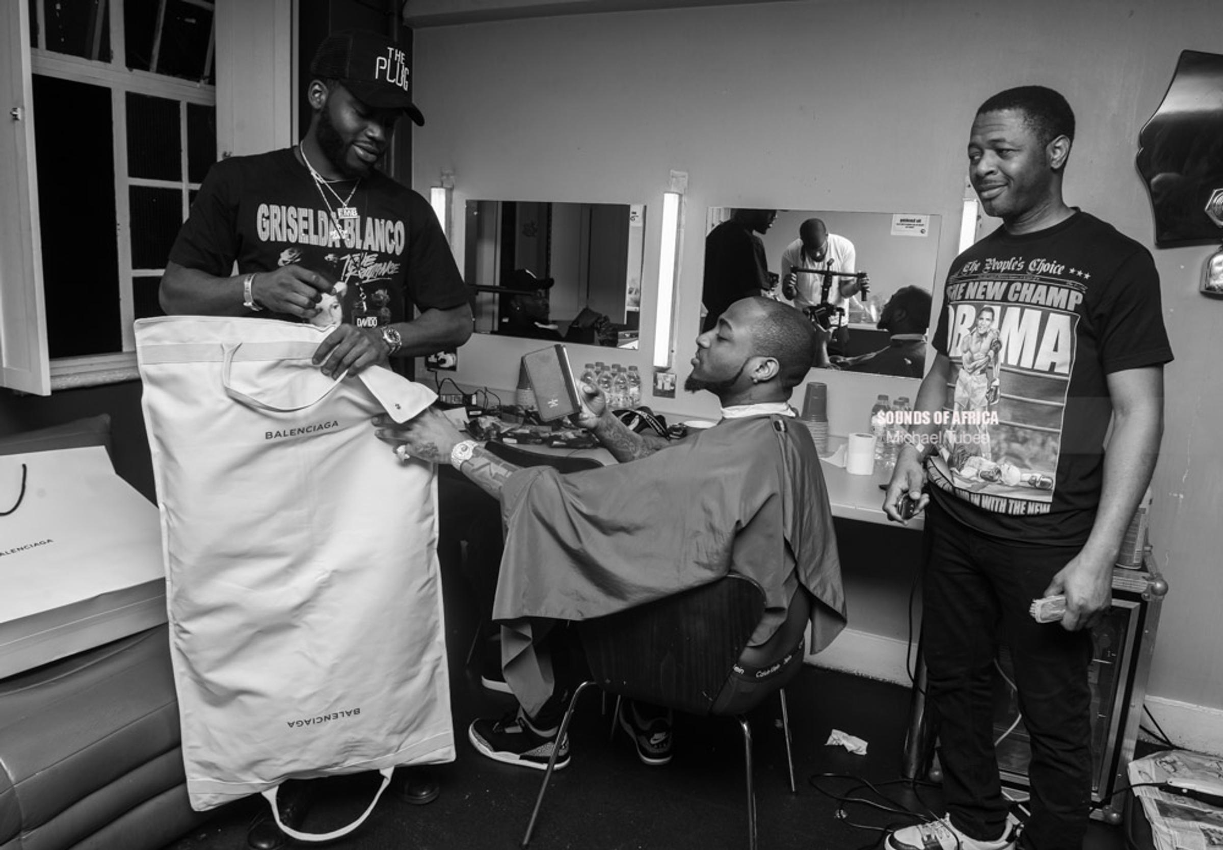 London, UK. 18th February, 2018. Backstage: Davido inspecting his stage cloths for his performance at the 02 Academy Brixton. Photographed Michael Tubes.