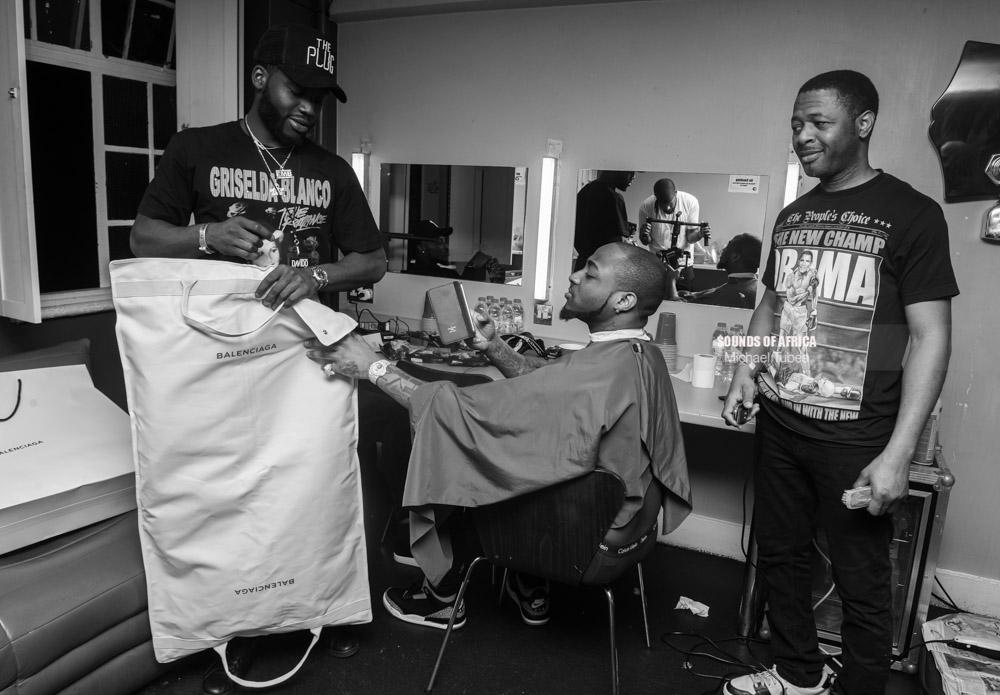 London, UK. 18th February, 2018. Backstage: Davido inspecting his stage cloths for his performance at the 02 Academy Brixton. Photographed Michael Tubes.