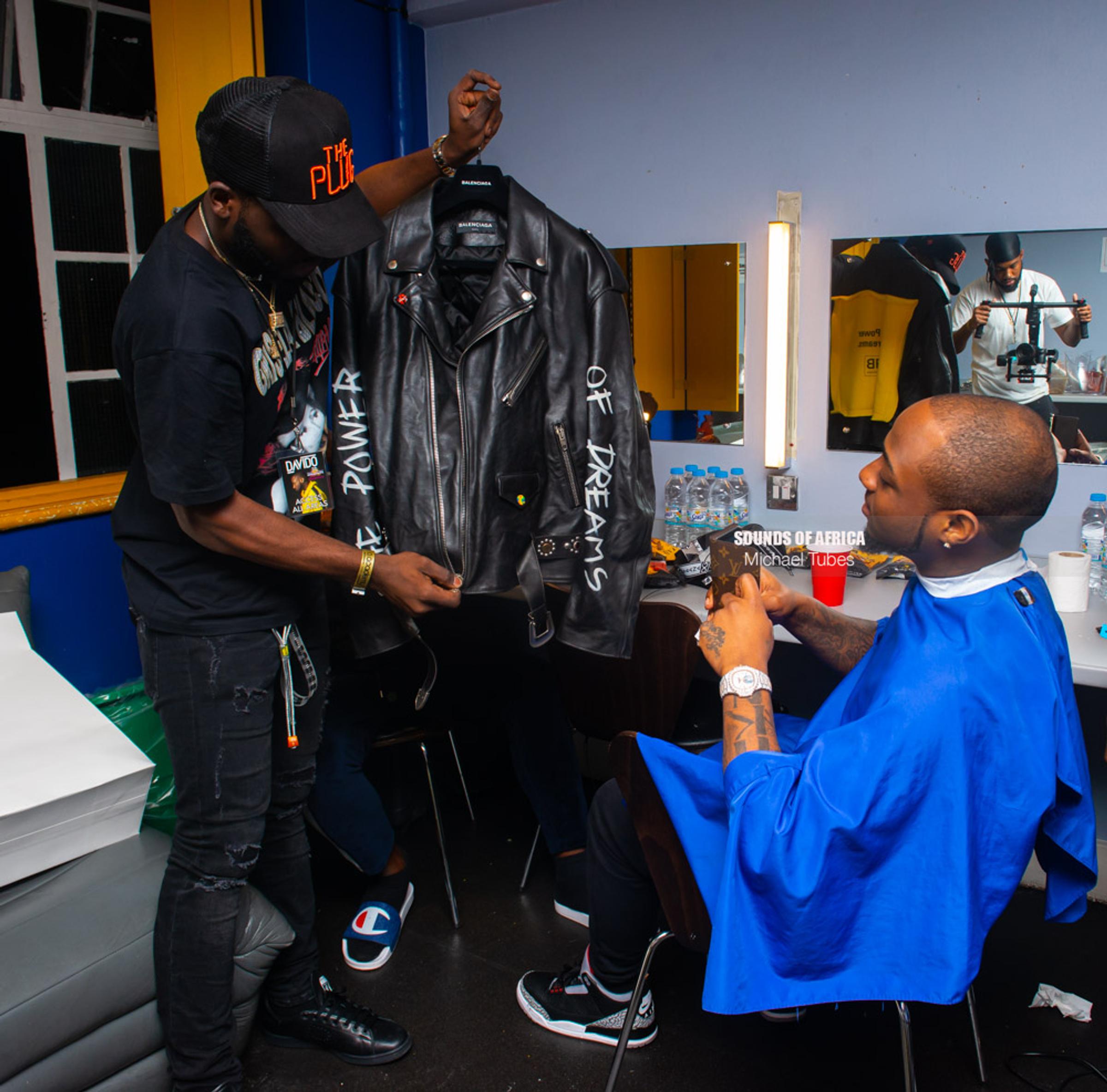 London, UK. 18th February, 2018. Backstage: Davido inspecting his stage cloths for his performance at the 02 Academy Brixton. Photographed Michael Tubes.