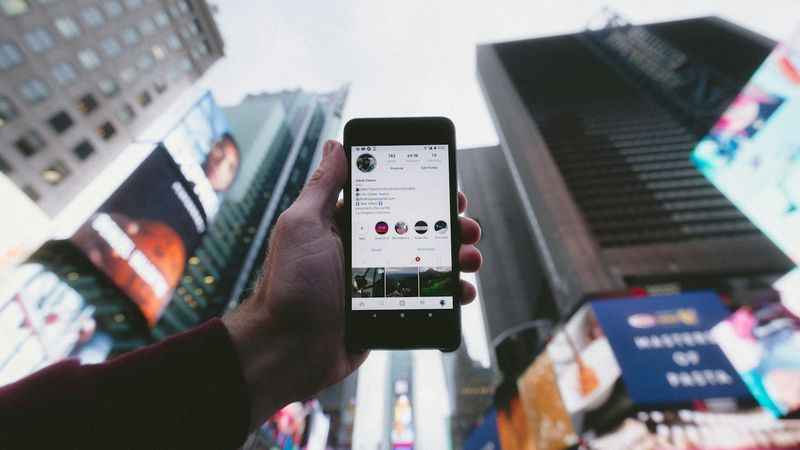 Person downloading content on phone