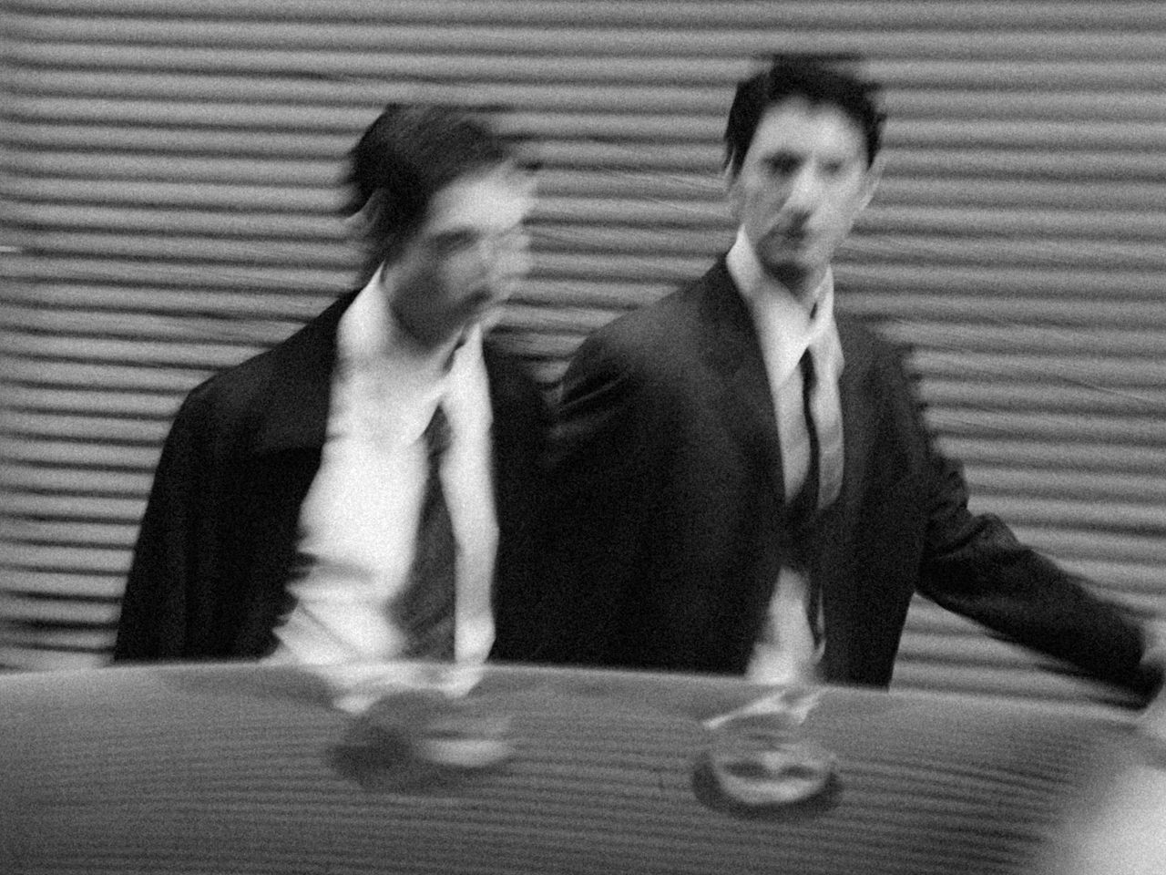blurry photo of 2 business men