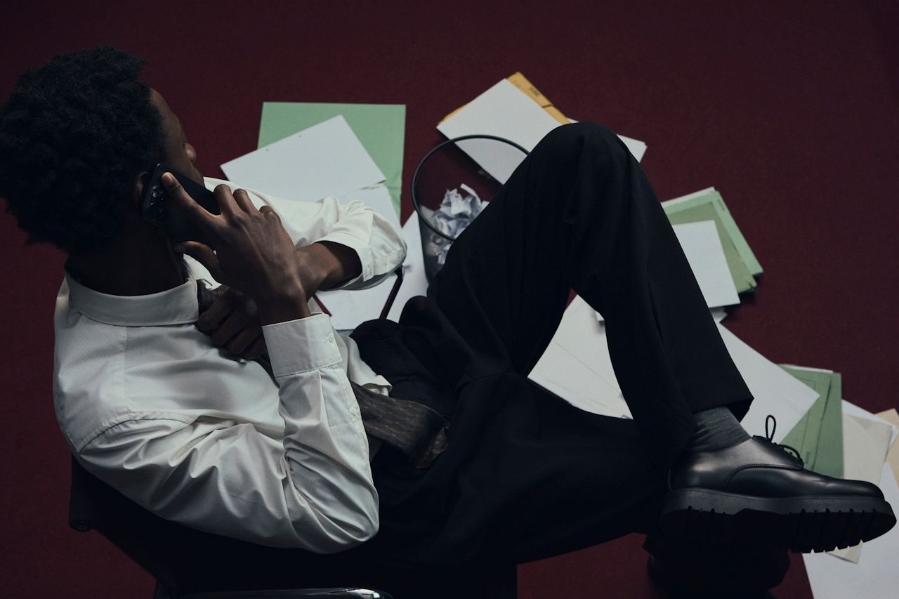 officeworker sitting on chair looking at p