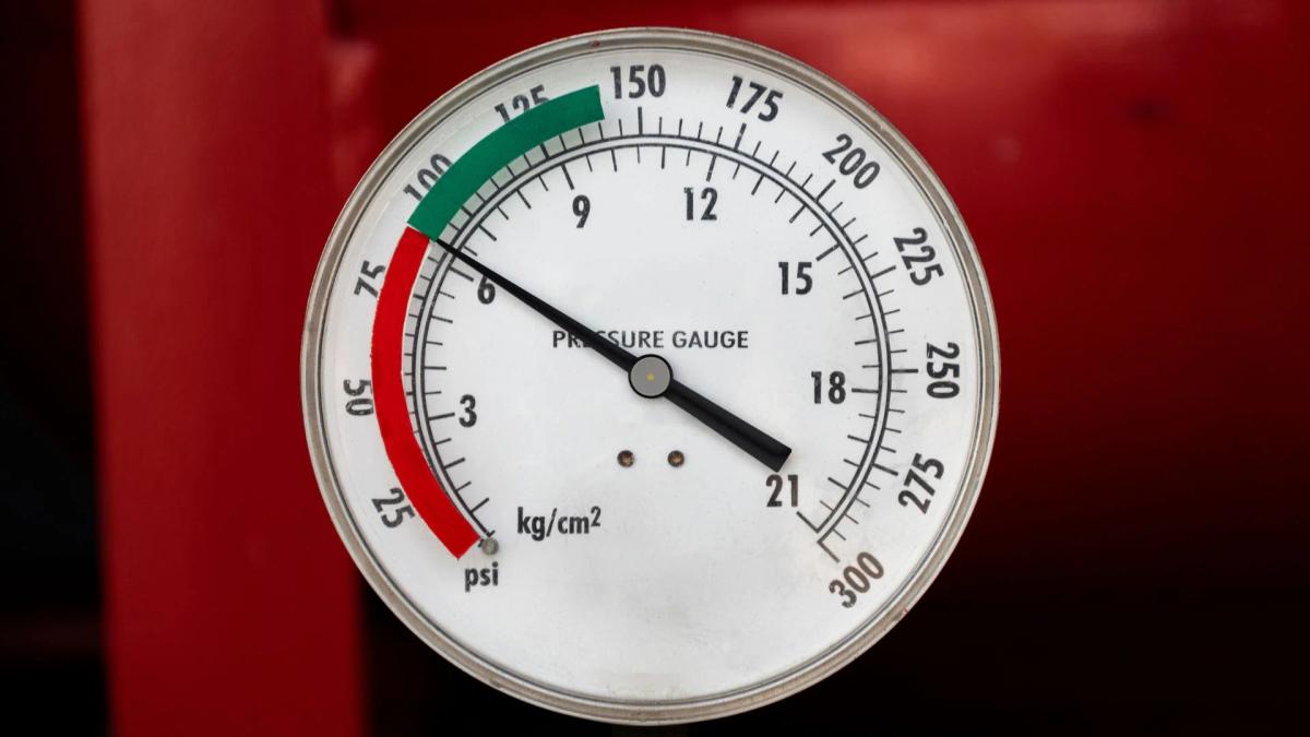 Industrial pressure gauge with the needle reading outside its marked green operating band.