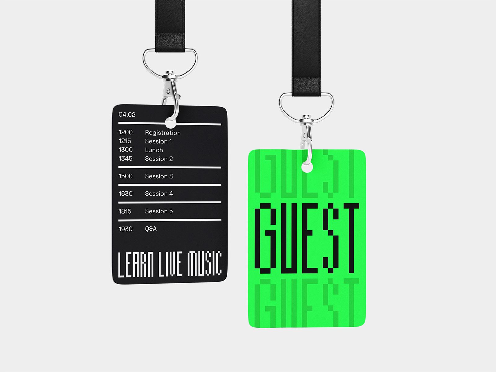 Black and fluorescent green Learn Live Music event passes suspended from black lanyards.