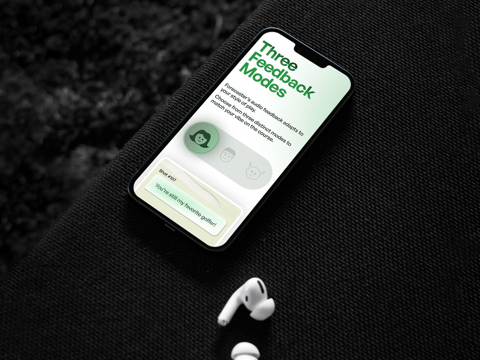 Forecaster mobile website displayed on a phone beside wireless earphones.