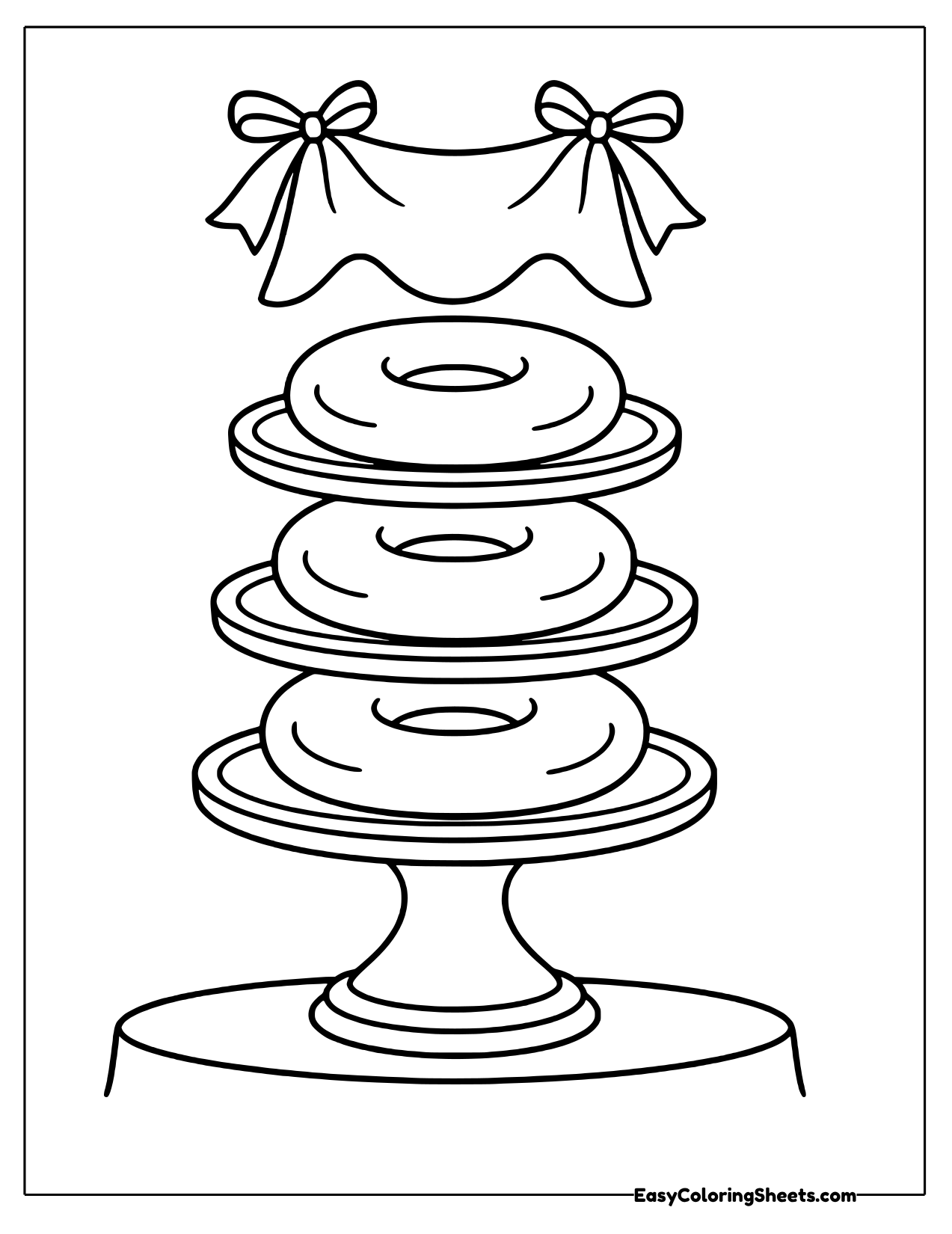 Bagels stacked on a cake stand with a bow
