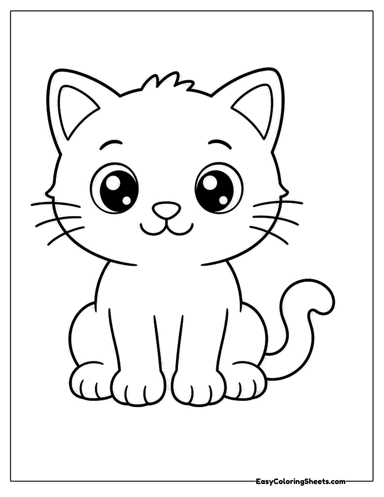 Cute kitten sitting with big shiny eyes
