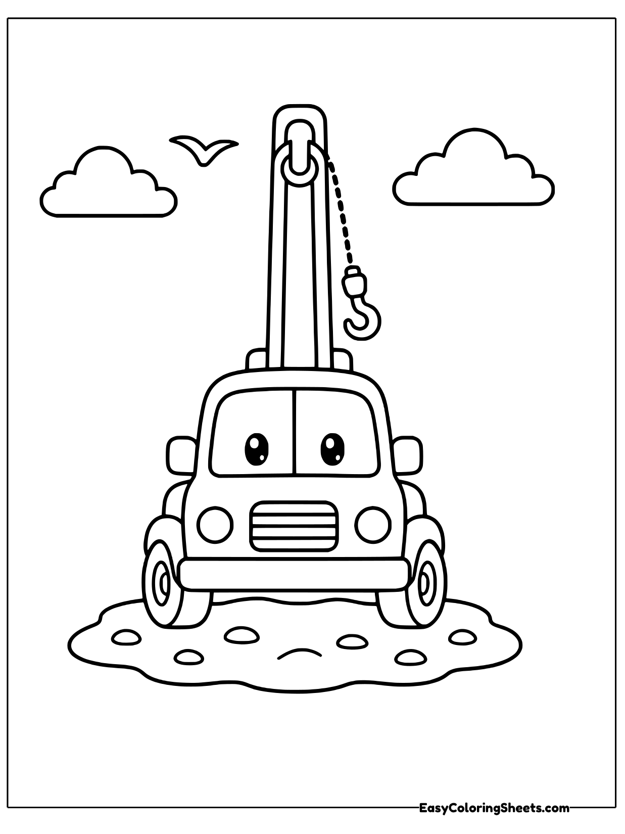 A tow truck with a friendly face and a tall crane hook rising above its cab stands on a patch of ground.