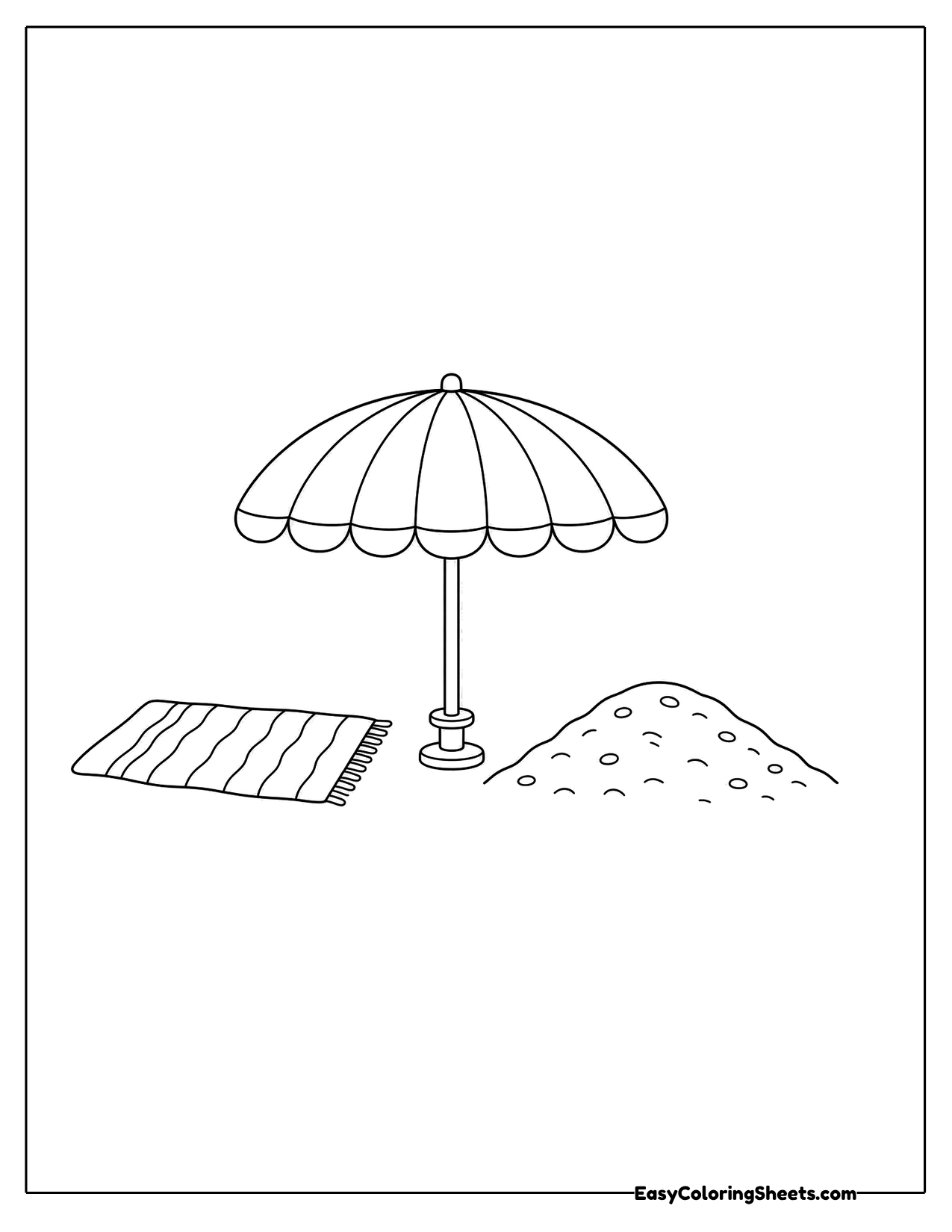 Beach umbrella beside a towel and sand pile